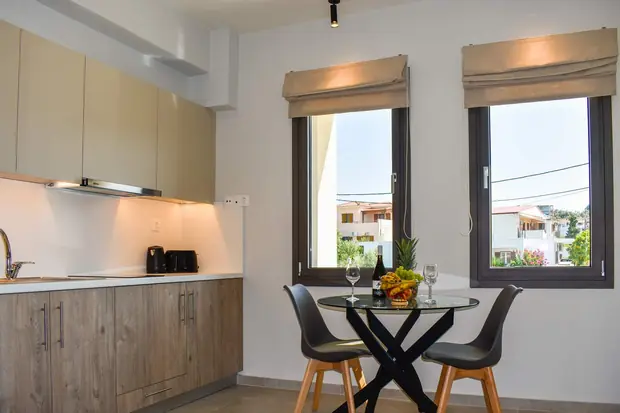 The kitchen and dining corner beside two windows